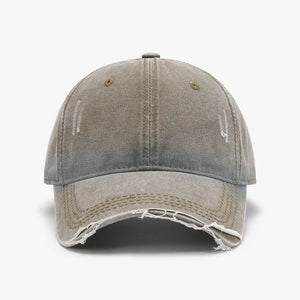 Faded denim baseball cap with distressed details and frayed brim