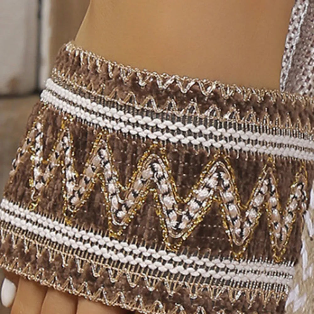 Embroidered espadrille slides in mocha with gold and white zigzag stitching detail.