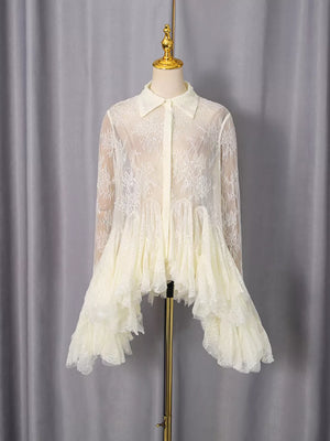 Apricot lace dress with ruffled hem and long sleeves.