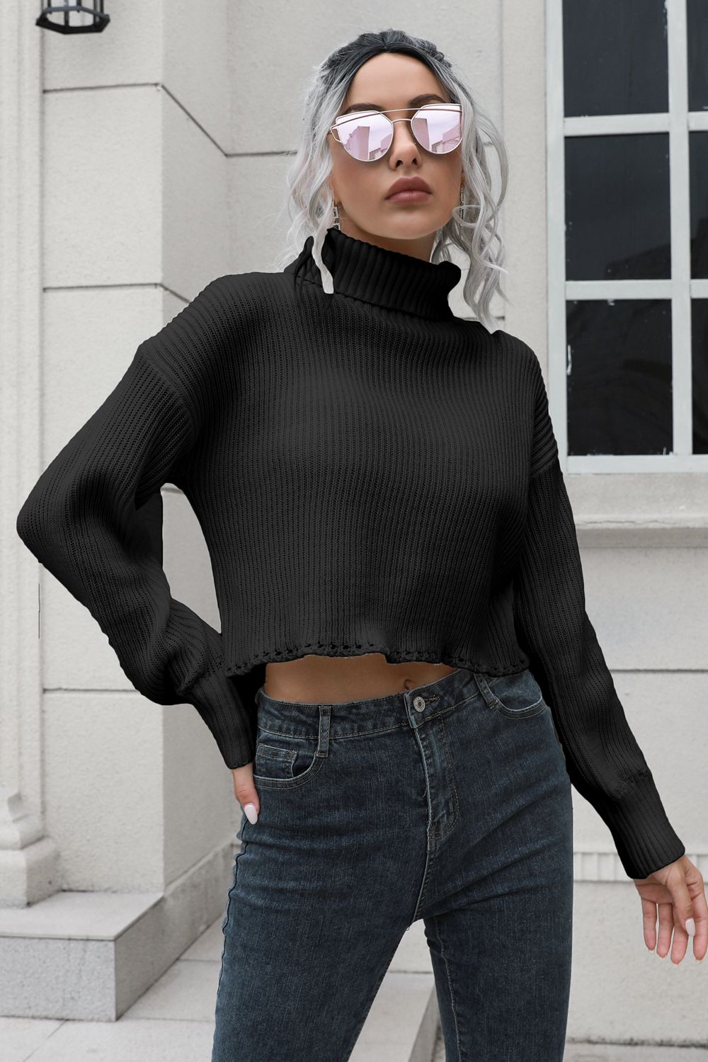 Black ribbed turtleneck sweater with scalloped hem and long sleeves