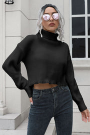 Black ribbed turtleneck sweater with scalloped hem and long sleeves