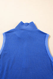 Royal blue ribbed knit sleeveless turtleneck top with vertical pinstripe texture.