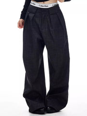 Men's dark grey wide-leg trousers with pleats and a textured fabric.