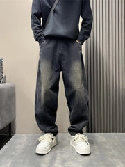 Men's oversized washed black tapered jeans with a baggy fit.