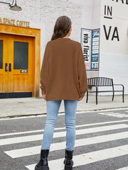Caramel balloon sleeve crewneck knit sweater with crew neckline and relaxed fit.