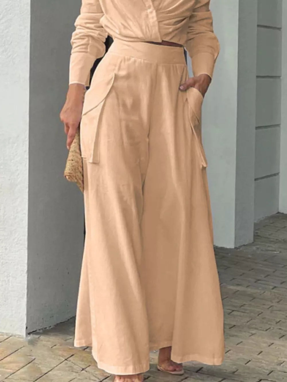 Chic two-piece set in tan polyester with pocketed wide-leg pants and a long-sleeve top.