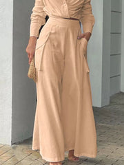 Chic two-piece set in tan polyester with pocketed wide-leg pants and a long-sleeve top.