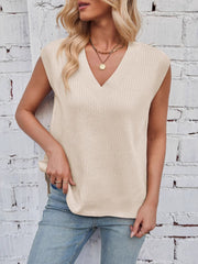Beige ribbed V-neck sweater vest with a casual fit, styled with jeans.