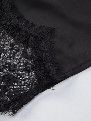 Black lace trim detail on a spaghetti strap dress