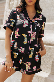 Black silk pajama set with colorful boot print and pink piping