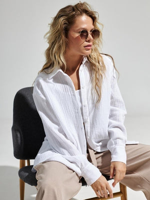 White textured cotton overshirt with relaxed fit and button-down front