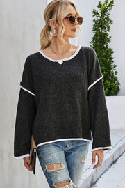 Oversized knit sweater in charcoal with white contrast trim and crew neck.