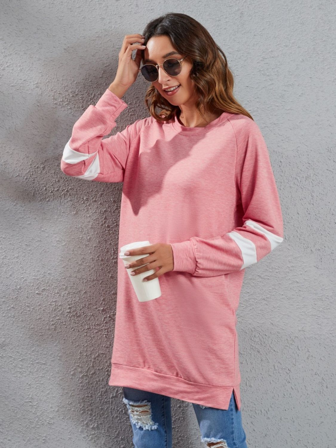 Varsity Stripe Raglan Sweatshirt Dress in Burnt Coral with white stripe details on sleeves.