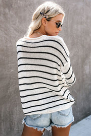 Relaxed white and black striped knit pullover sweater with a crew neck.