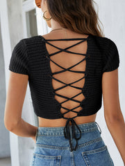 Black crochet crop top with short sleeves and a lace-up back detail.