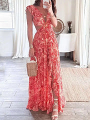 Elegant ruffled V-neck maxi dress in deep red paisley print with cut-outs and a thigh-high slit.