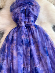 Romantic floral mesh maxi dress in electric purple with ruched detail.