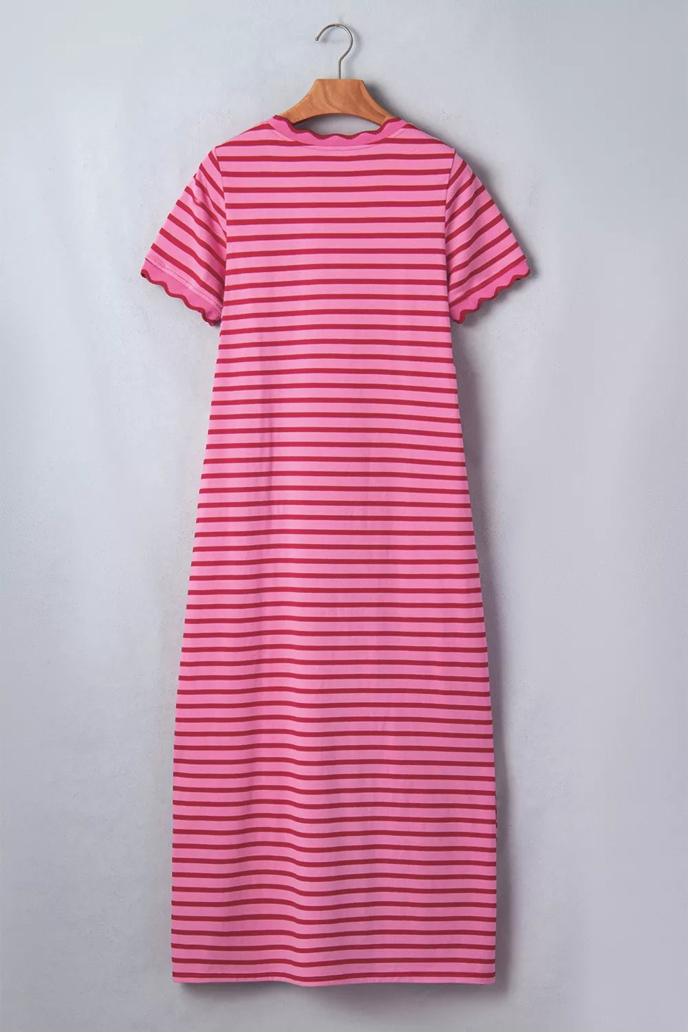 Vibrant striped maxi tee dress in pink and red with scalloped trim and short sleeves.