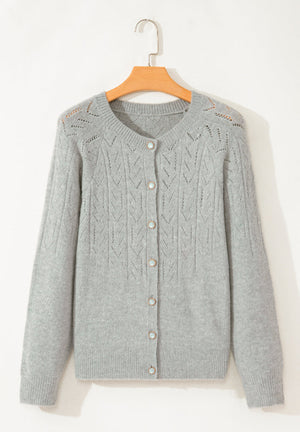 Gray lace-effect knit button-down cardigan with pearl buttons and a crew neck.