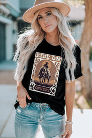 Black graphic t-shirt with a cowboy riding a horse and "RIDE ON COWBOY" text.