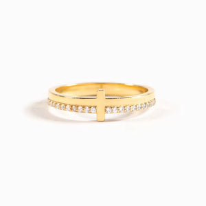 Gold ring with a cross and diamond trim detail
