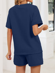 Navy blue loungewear shorts and t-shirt set with drawstring waist.