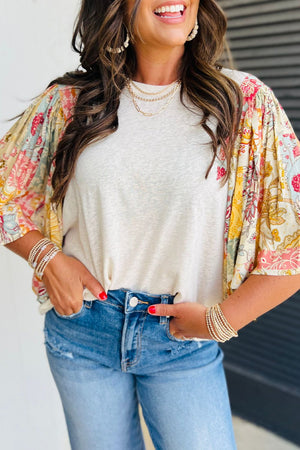 Beige t-shirt with patchwork floral print puff sleeves and a crew neck.