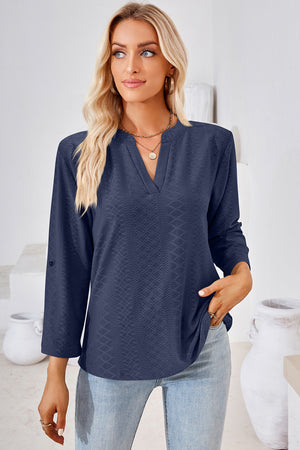 Textured henley shirt in dark blue with v-neck and roll-tab sleeves.