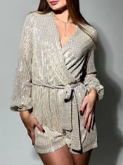 Sequin wrap romper in beige with blouson sleeves and tie waist.