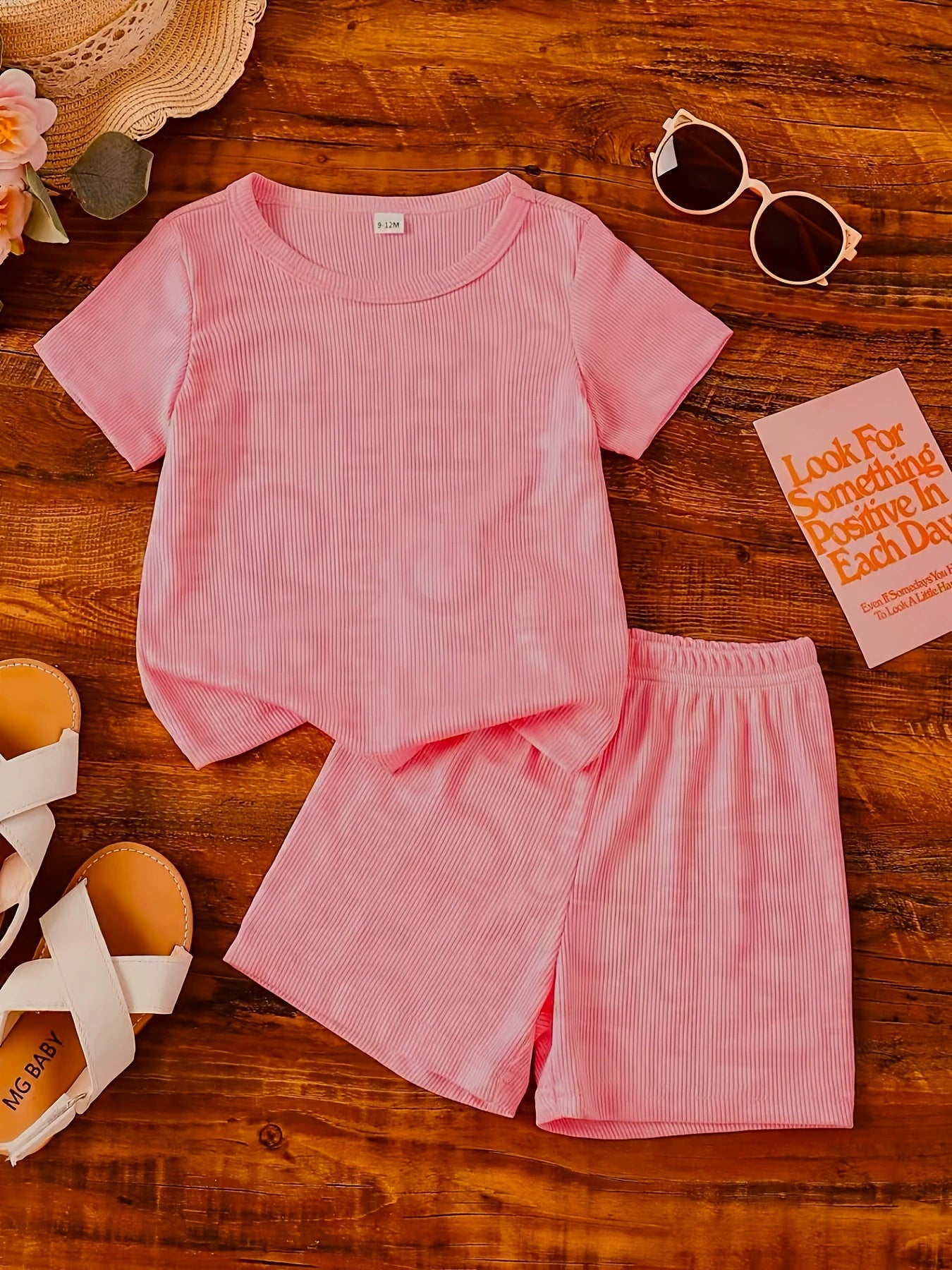 Children's pink ribbed knit tee and shorts set, crew neck, short sleeve, comfortable casual outfit.