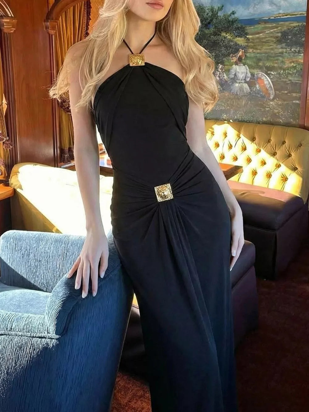 Black halter neck ruched maxi dress with gold square detail at bust and waist.