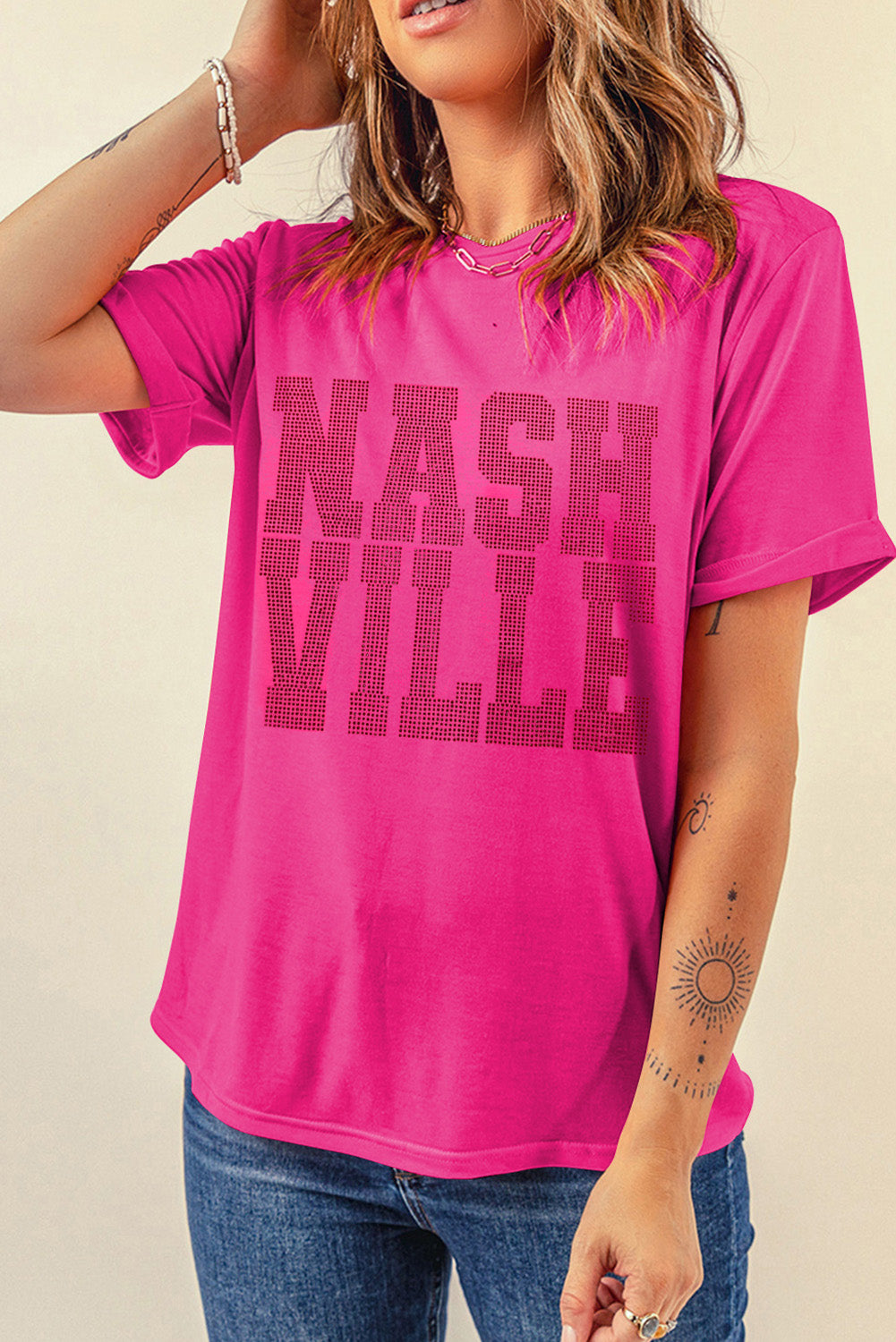 Hot pink t-shirt with rolled sleeves and Nashville graphic print