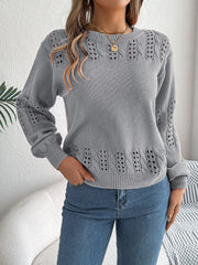 Gray acrylic knit sweater with openwork detail on sleeves and hem.