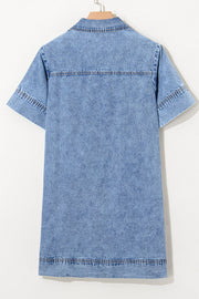 Light blue denim mini dress with short sleeves, collar, and double-stitched hem and yoke.
