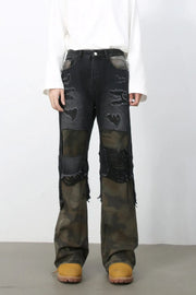 Distressed dark camo panel flare jeans with ripped details.