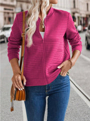 Deep Rose quilted bomber jacket with zip closure and stand-up collar.