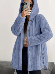 Blue button-up fleece jacket with hood and textured fabric.