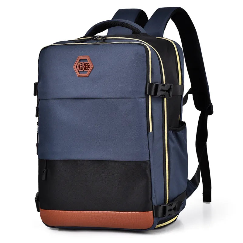 Dusty blue and black travel backpack with contrast panels and brown faux leather trim.