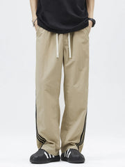 Khaki casual drawstring pants with side stripe detail and loose fit
