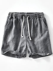 Men's relaxed fit gray drawstring shorts with elastic waistband and pockets.