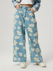Daisy Field Wide Leg Denim jeans in light wash with a white floral print and button fly.