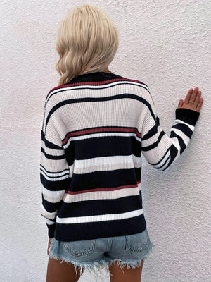 Pastel stripe crewneck knit sweater with black, white, beige, and red stripes.