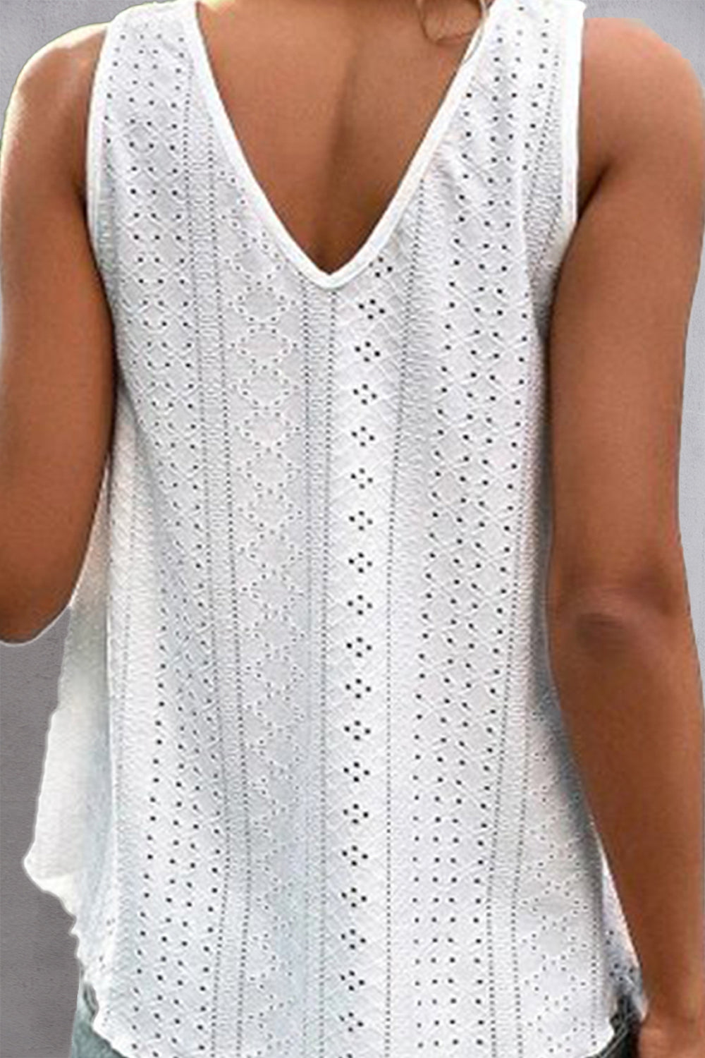 White eyelet inset V-neck tank top with a casual, chic style.