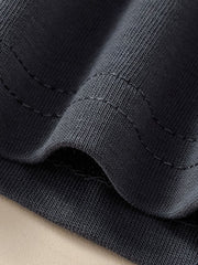Kids dark gray cotton t-shirt detail showing ribbed texture and stitching.