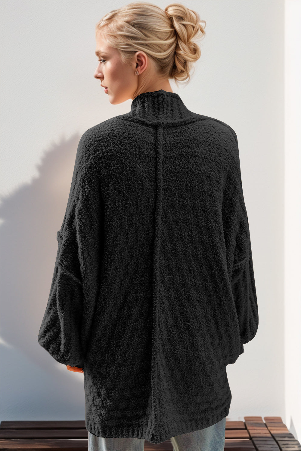 Black textured bouclé cocoon cardigan with balloon sleeves and mock neck