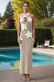 Crochet halter midi dress in cream with white floral appliques and a cutout neckline.