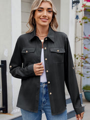 Black utility crepe shirt with button-flap chest pockets and roll-tab sleeves.