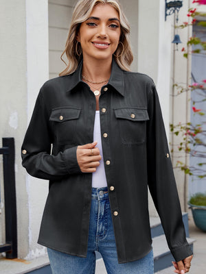 Black utility crepe shirt with button-flap chest pockets and roll-tab sleeves.