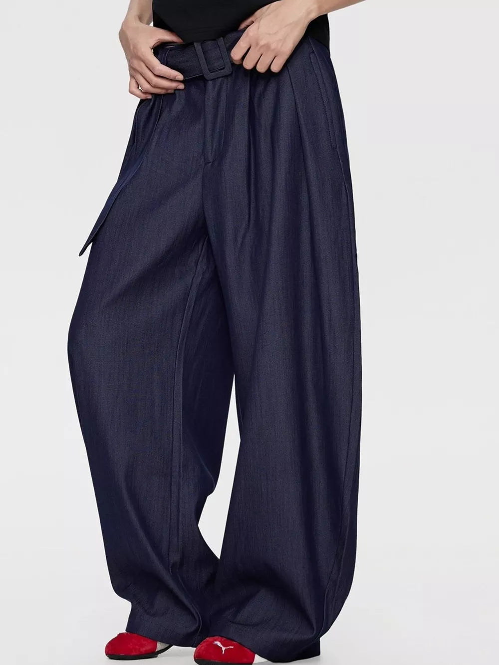 Men's blue wide-leg dress pants with a belted waist and pleats.