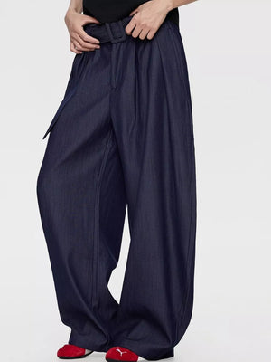 Men's blue wide-leg dress pants with a belted waist and pleats.